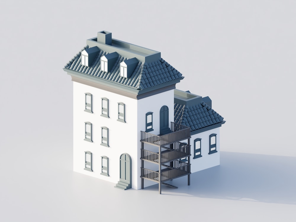 A white building with a dark roof and balconies.